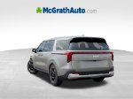 2027 Kia Carnival EX — Ivory exterior view 5, for sale at McGrath Ford in Hiawatha, IA