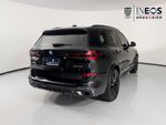 2026 BMW X5 xDrive40i — Black Sapphire Metallic exterior view 7, for sale at RDS Ineos Grenadier in Devon, PA
