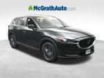 2019 Mazda CX-5 Touring — Jet Black exterior view 2, for sale at McGrath Ford in Hiawatha, IA
