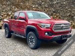 2016 Toyota Tacoma TRD Off-Road — Barcelona Red Metallic interior and detail view 10, for sale at A Better Way Wholesale Autos in Naugatuck, CT