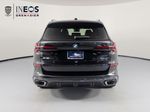 2026 BMW X5 xDrive40i — Black Sapphire Metallic exterior view 5, for sale at RDS Ineos Grenadier in Devon, PA