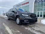 2024 Chrysler Pacifica Touring L — Diamond Black exterior view 3, for sale at Williams Brothers Dodge Chrysler Jeep Ram of Dundee in Dundee, MI