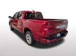2026 Ram 1500 Big Horn/Lone Star — Molten Red exterior view 3, for sale at Ryan CDJR Buffalo in Buffalo, MN