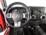 2015 Jeep Wrangler Unlimited Freedom Edition — Red interior and detail view 14, for sale at RDS Ineos Grenadier in Devon, PA