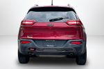 2015 Jeep Cherokee Trailhawk — Deep Cherry Red Crystal Pearlcoat exterior view 6, for sale at Lakeside Automotive Group in Spring Lake, MI