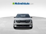 2027 Kia Carnival EX — Ivory exterior view 2, for sale at McGrath Ford in Hiawatha, IA