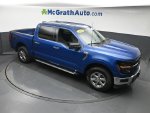 2025 Ford F-150 XLT — Blue Metallic exterior view 3, for sale at McGrath Ford in Hiawatha, IA