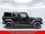 2016 Jeep Wrangler Unlimited Sport — Black Clearcoat exterior view 8, for sale at Shift Innovations Car Co in Puyallup, WA