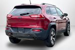 2015 Jeep Cherokee Trailhawk — Deep Cherry Red Crystal Pearlcoat exterior view 5, for sale at Lakeside Automotive Group in Spring Lake, MI