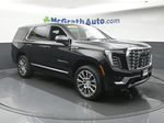 2026 GMC Yukon Denali — Onyx Black exterior view 2, for sale at McGrath Ford in Hiawatha, IA