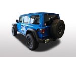 2026 Jeep Wrangler Willys — Blue Pearl exterior view 3, for sale at Ryan CDJR Buffalo in Buffalo, MN