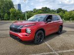 2026 Nissan Rogue Plug-In Hybrid SL — Royal Red exterior view 2, for sale at Downtown Nashville Nissan in Nashville, TN