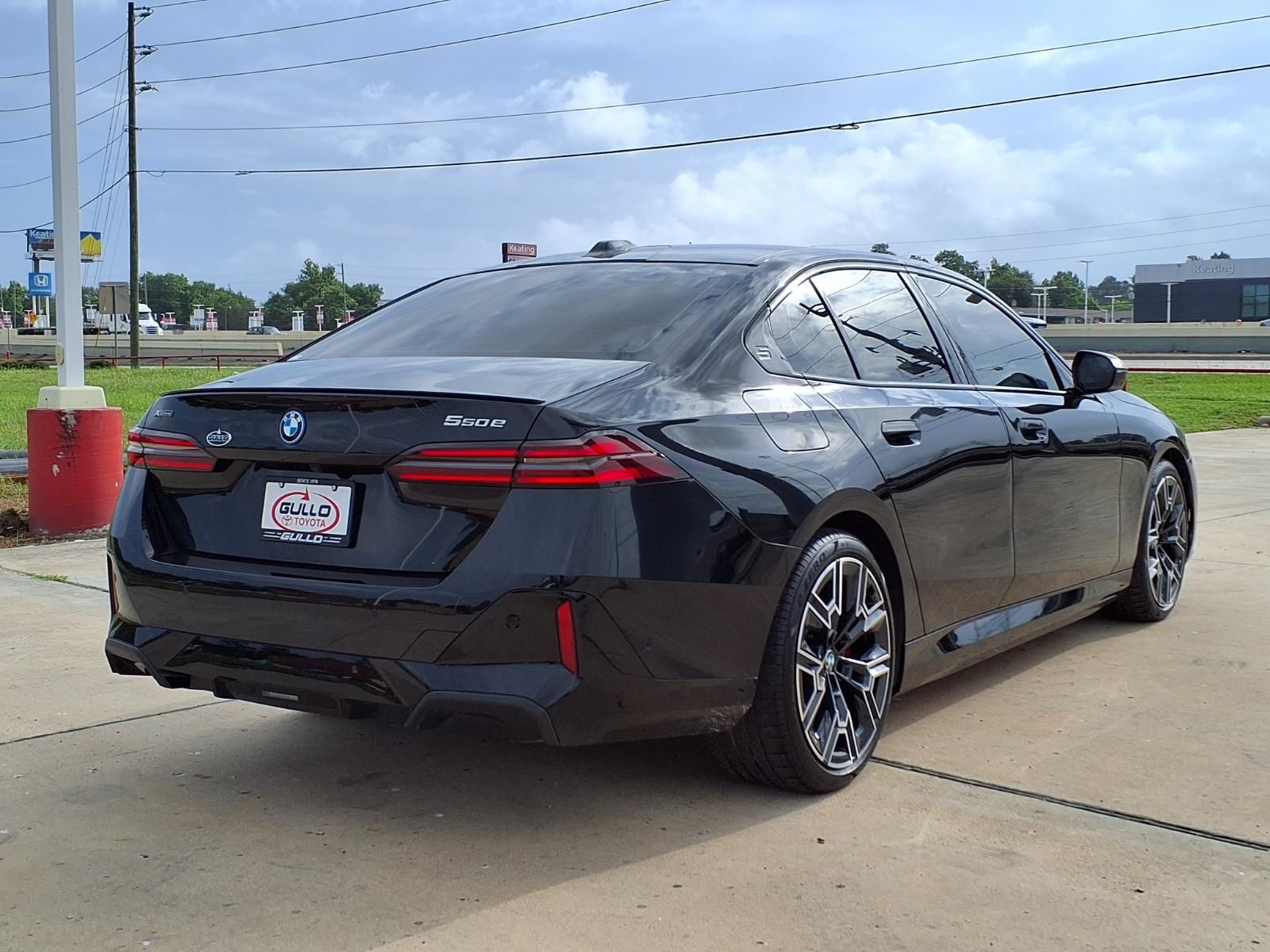 2026 BMW 5 Series 550e xDrive Black at Central Houston Nissan