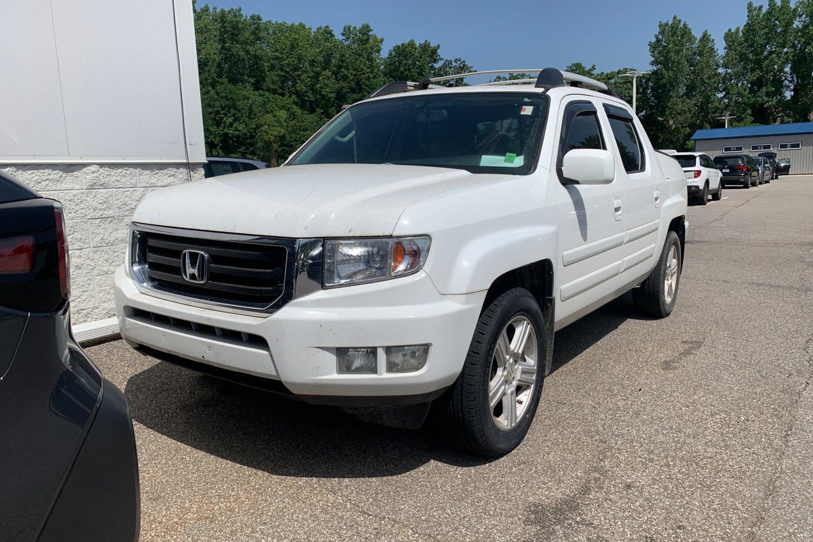 White 2014 Honda Ridgeline Pickup Truck Four-Wheel Drive 5-Speed Automatic
