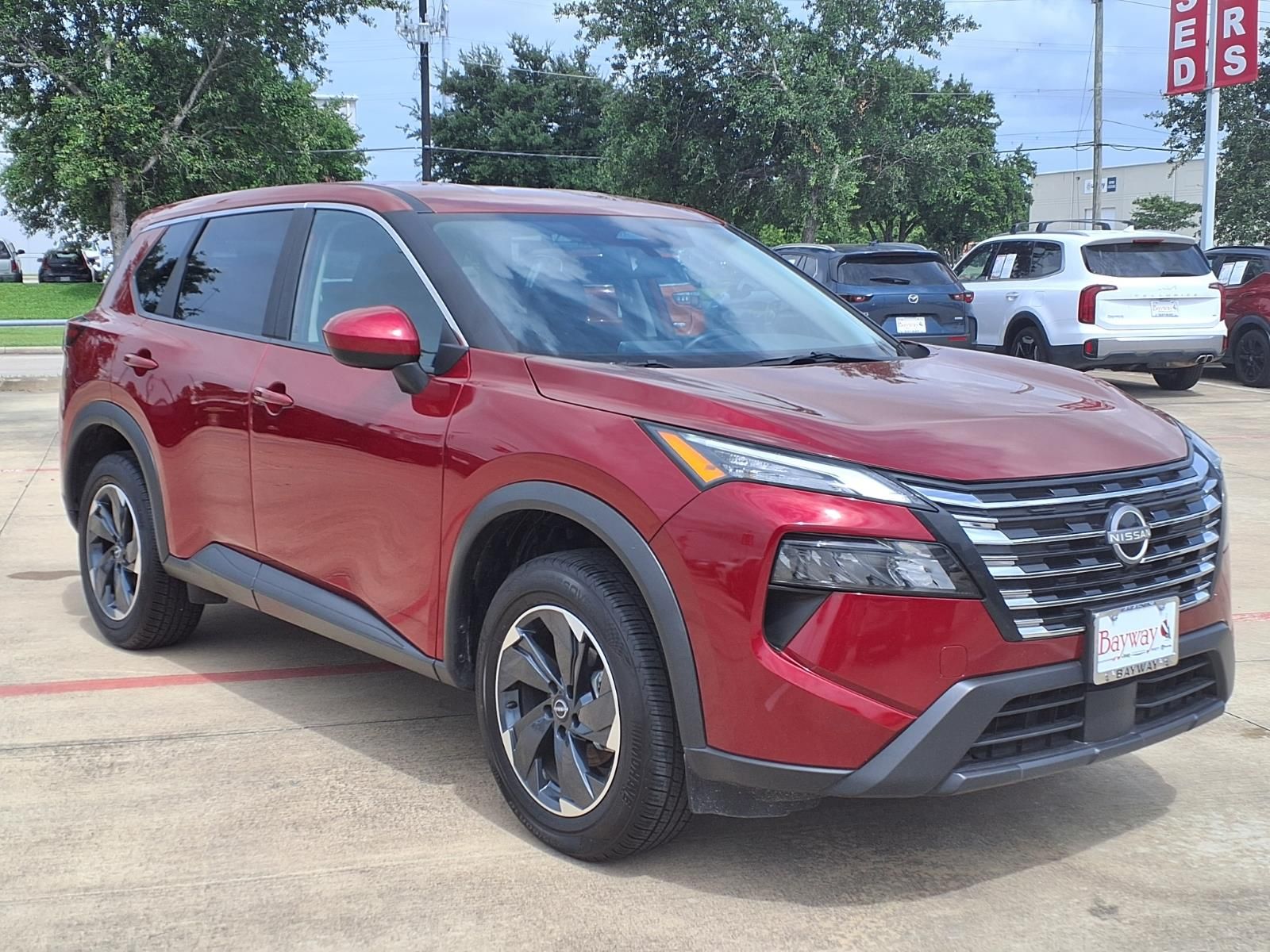 2025 Nissan Rogue SV Red at Central Houston Nissan