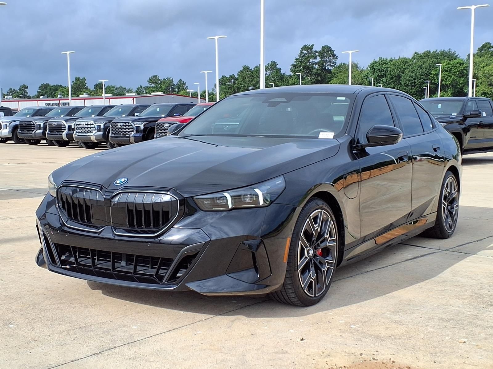 2026 BMW 5 Series 550e xDrive Black at Central Houston Nissan