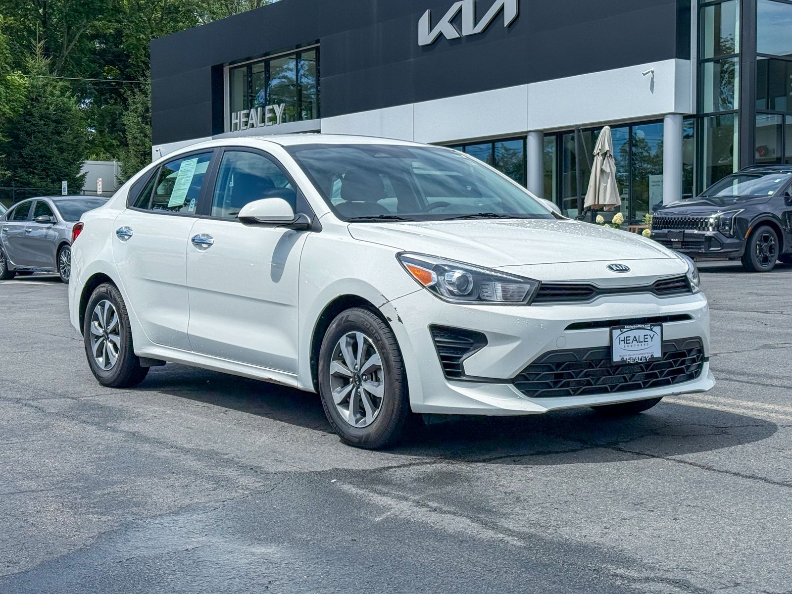 Clear White 2021 Kia Rio Sedan Front-Wheel Drive Continuously Variable Transmission