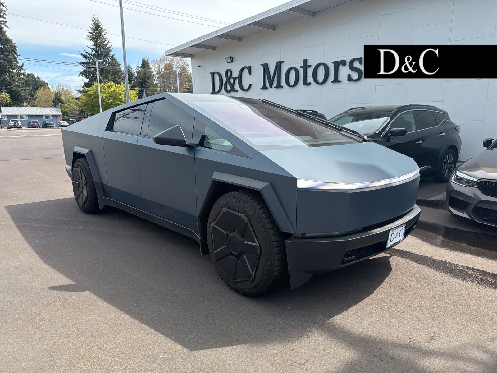 Gray (Stainless Steel) 2024 Tesla Cybertruck Crew Cab AWD Pickup Truck All-Wheel Drive 1-Speed Automatic