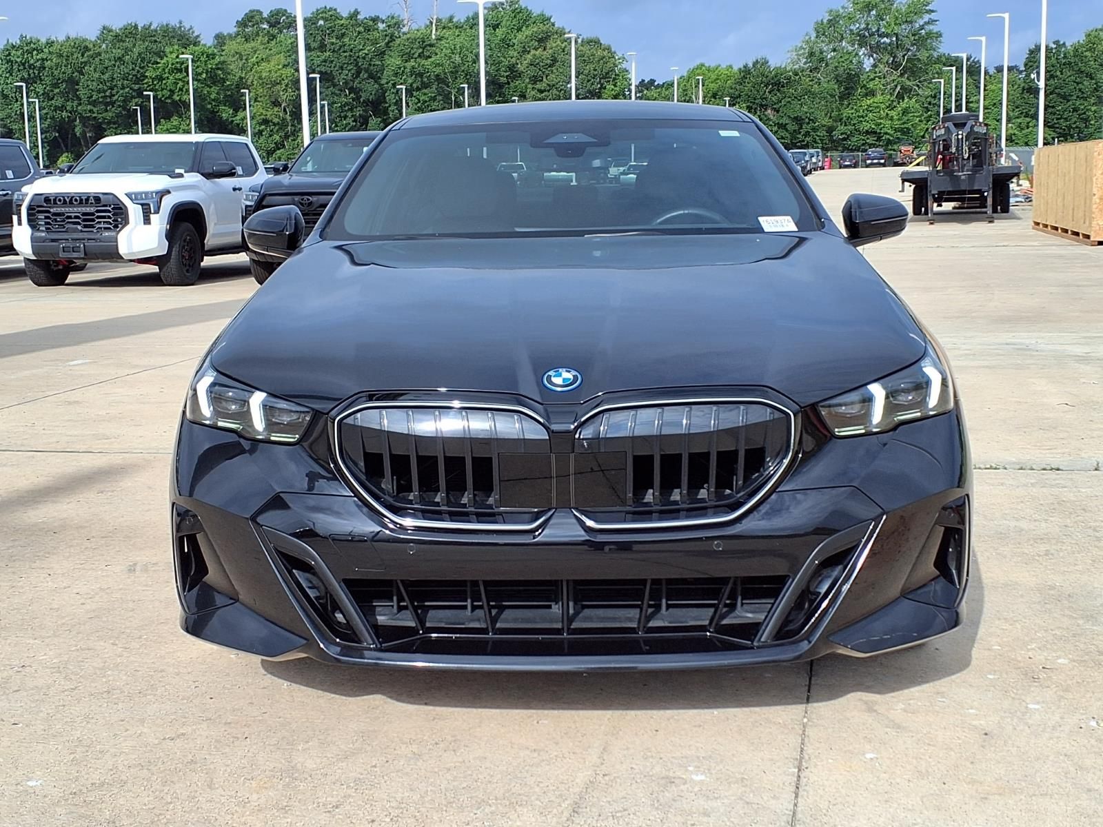 2026 BMW 5 Series 550e xDrive Black at Central Houston Nissan