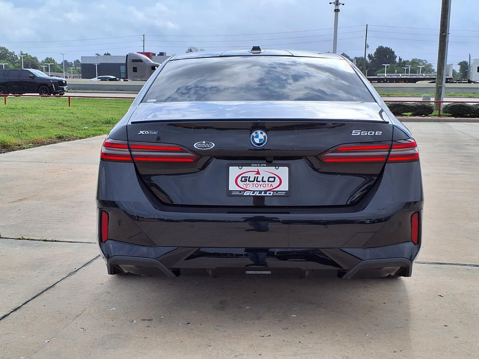 2026 BMW 5 Series 550e xDrive Black at Central Houston Nissan