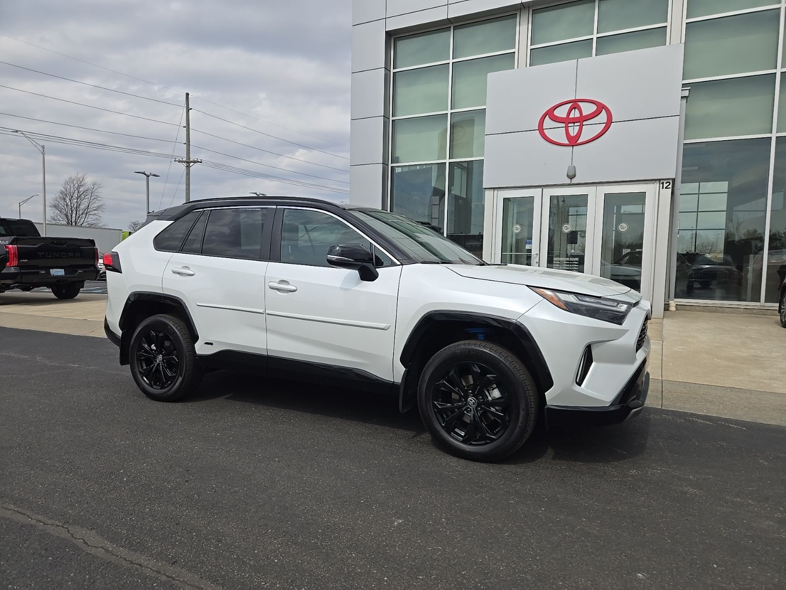 Wind Chill Pearl/Midnight Black Metallic 2025 Toyota RAV4 Hybrid XSE AWD SUV / Crossover All-Wheel Drive Continuously Variable Transmission