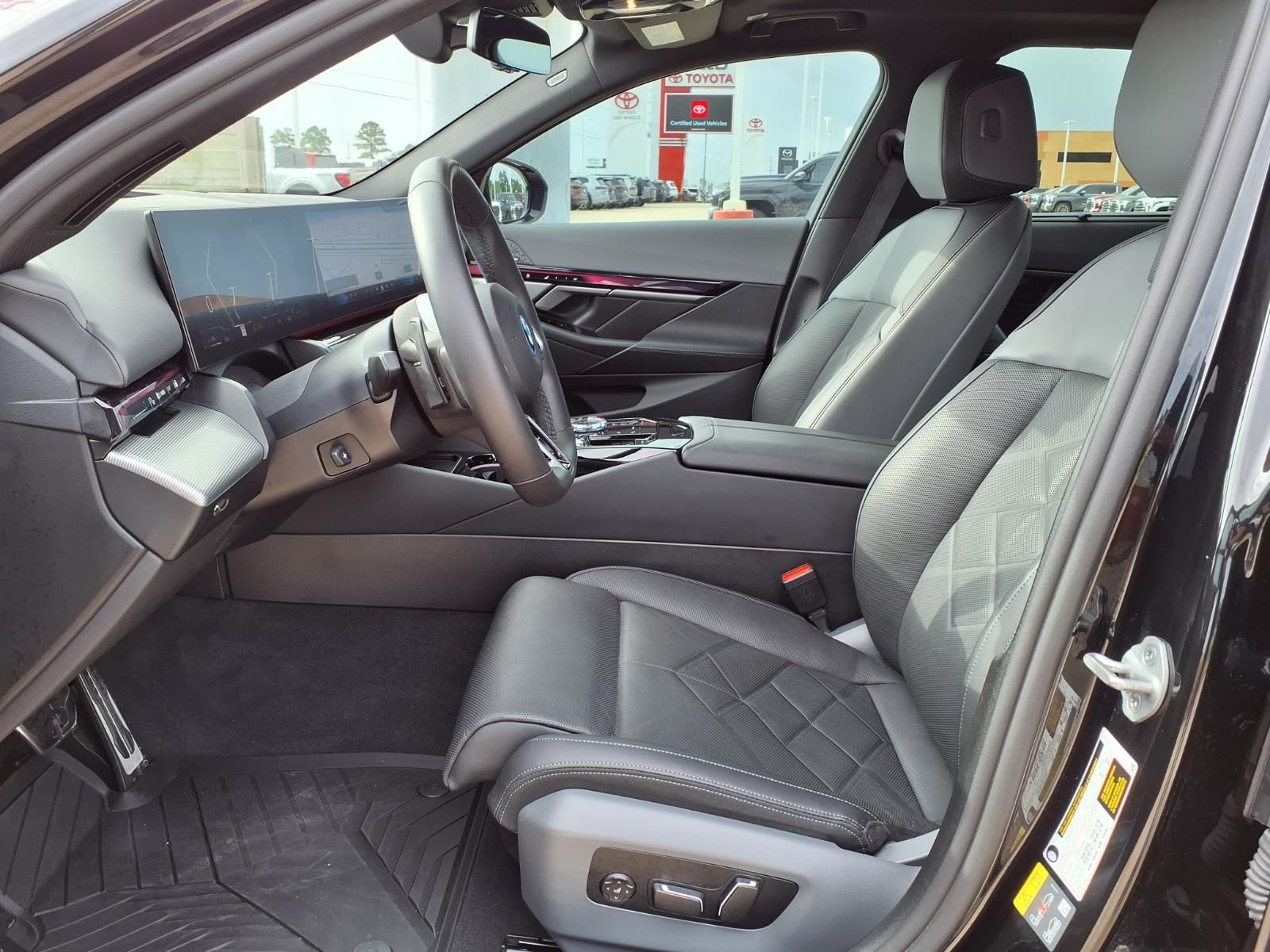 2026 BMW 5 Series 550e xDrive Black at Central Houston Nissan
