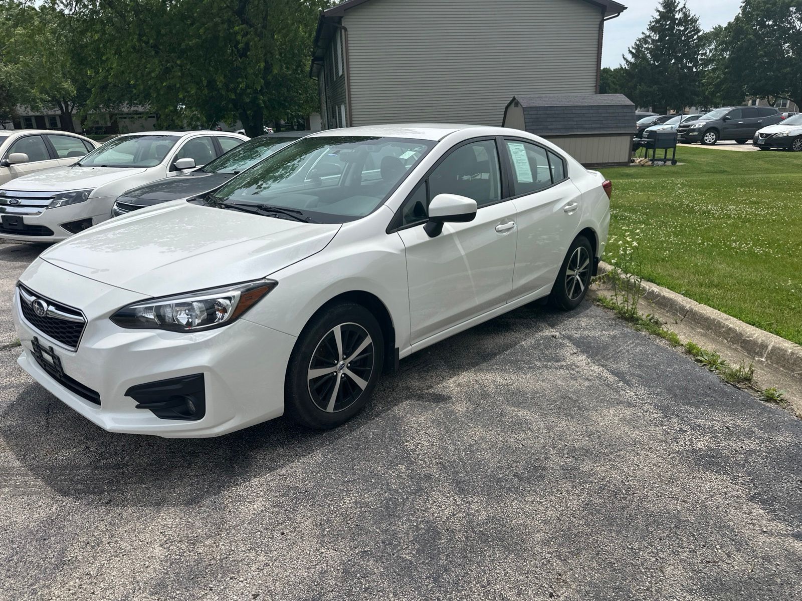 Crystal White Pearl 2019 Subaru Impreza 2.0i Premium Sedan AWD Sedan All-Wheel Drive Continuously Variable Transmission