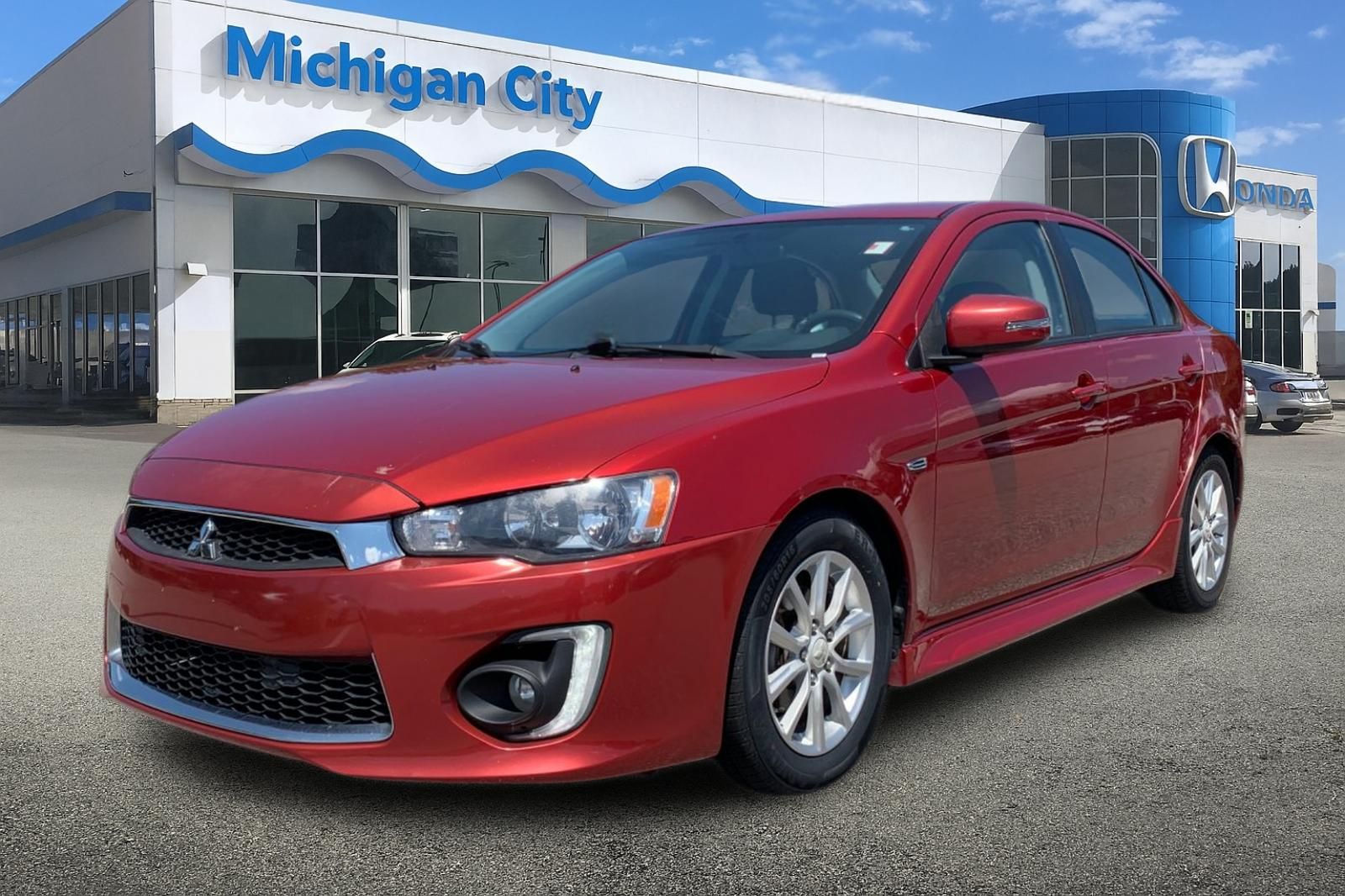Rally Red Metallic 2016 Mitsubishi Lancer Sedan All-Wheel Drive Continuously Variable Transmission
