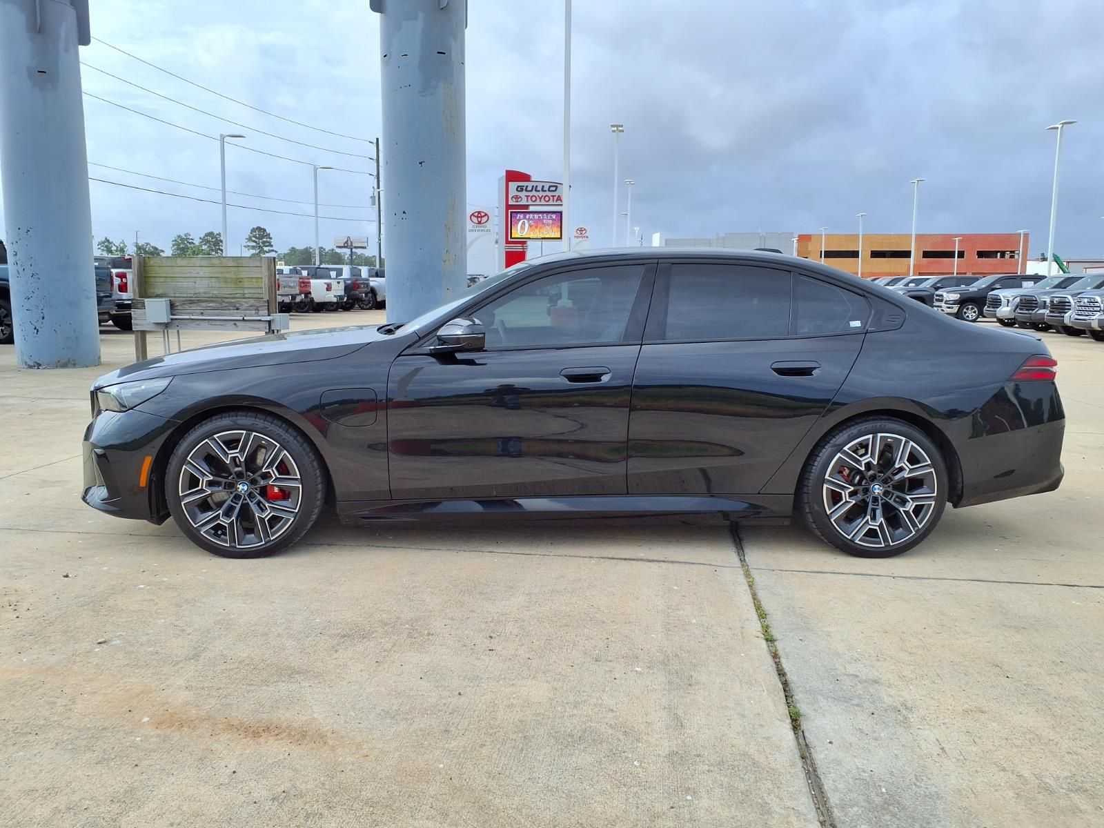 2026 BMW 5 Series 550e xDrive Black at Central Houston Nissan