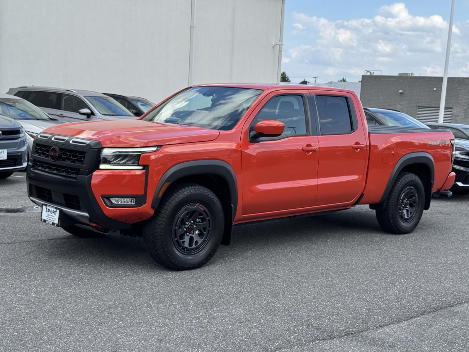 Afterburn Orange 2025 Nissan Frontier Pickup Truck Four-Wheel Drive 9-Speed Automatic Overdrive