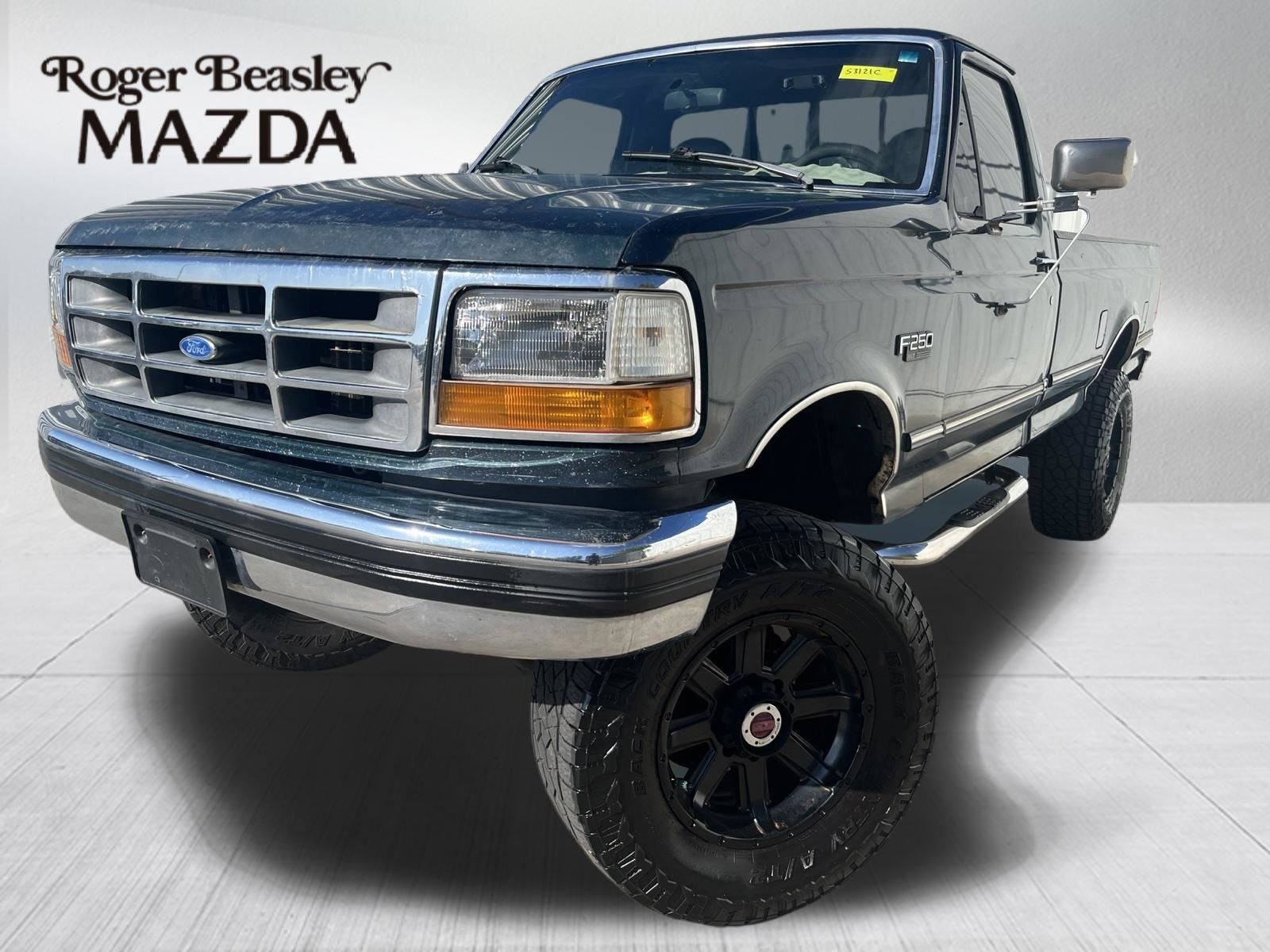 Green / Silver 1993 Ford F-250 Pickup Truck Four-Wheel Drive 3-Speed Automatic