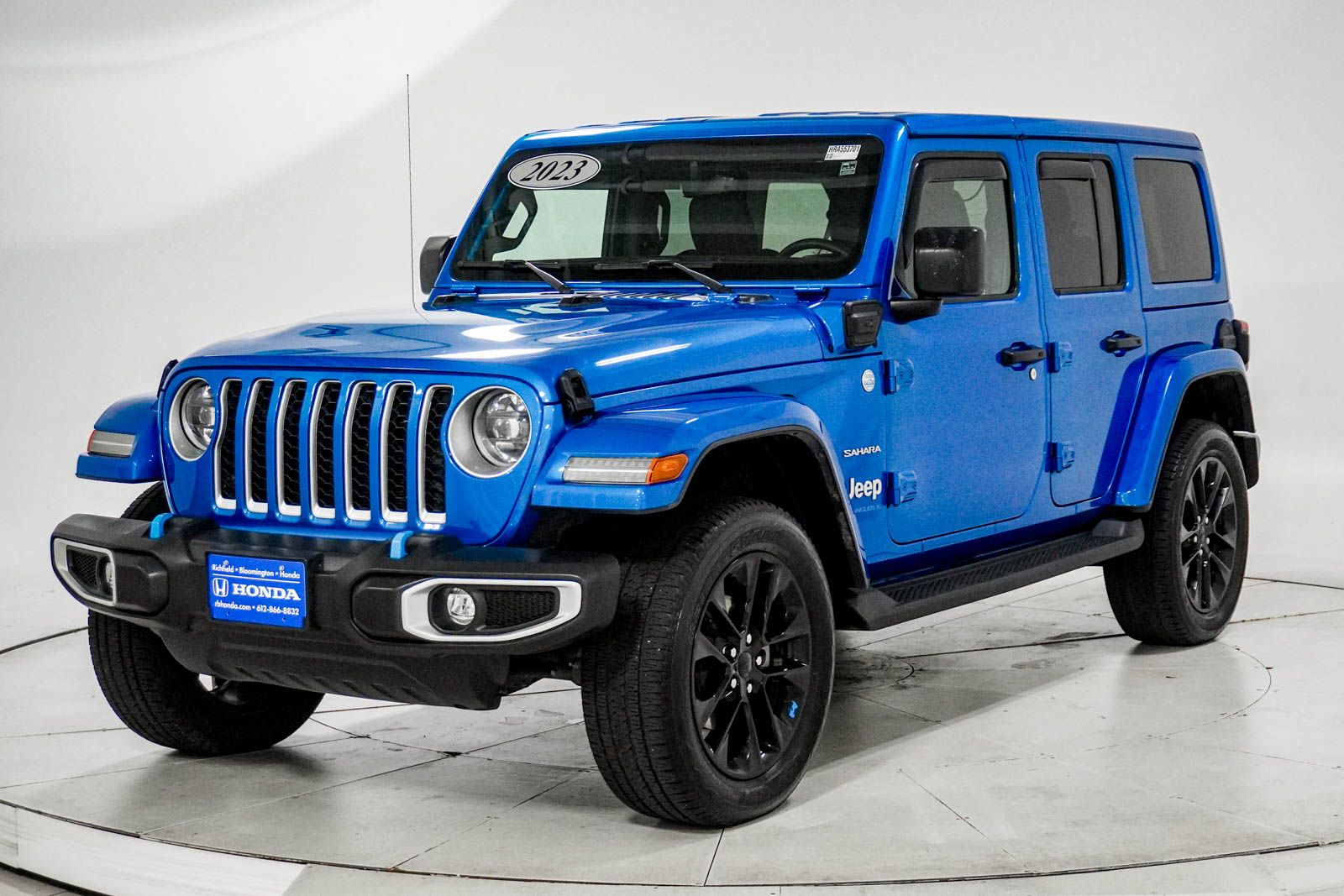 Used 2023 Jeep Wrangler 4xe Sahara 4XE with VIN 1C4JJXP64PW553701 for sale in Richfield, Minnesota