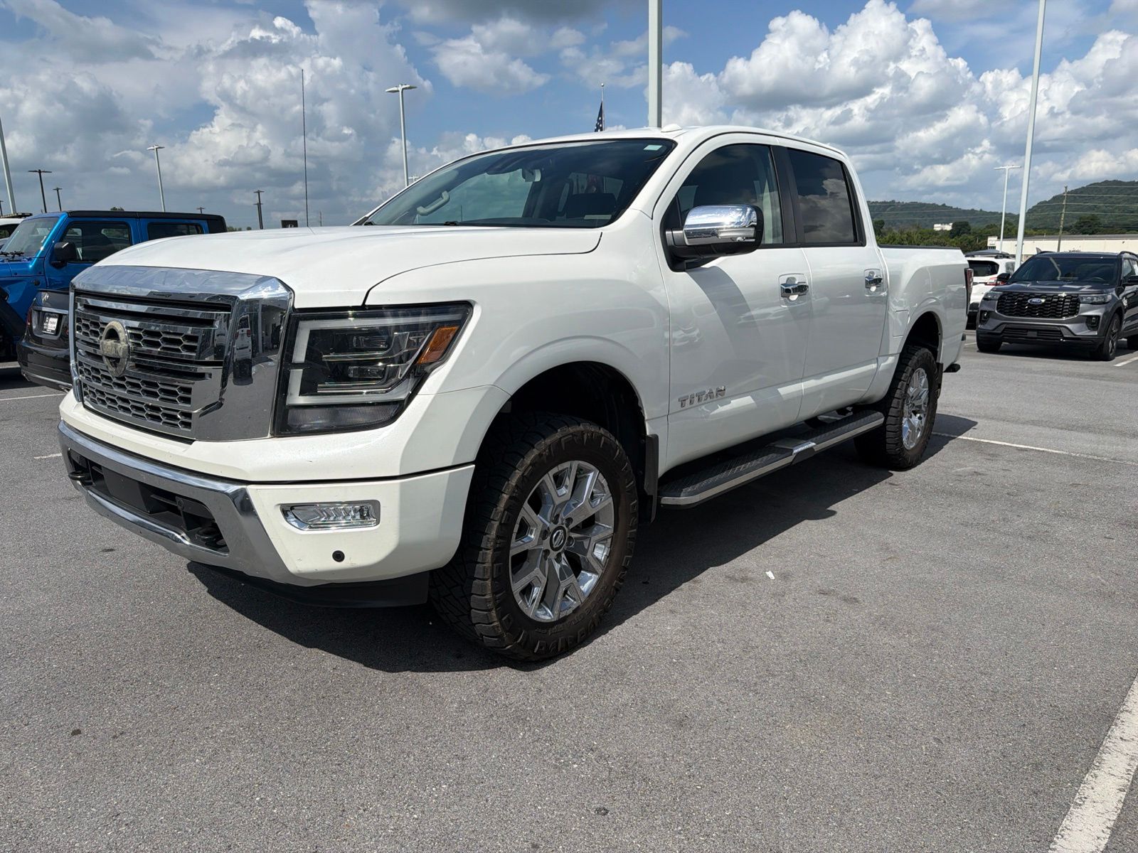 Pearl White 2021 Nissan Titan Pickup Truck Four-Wheel Drive 9-Speed Automatic