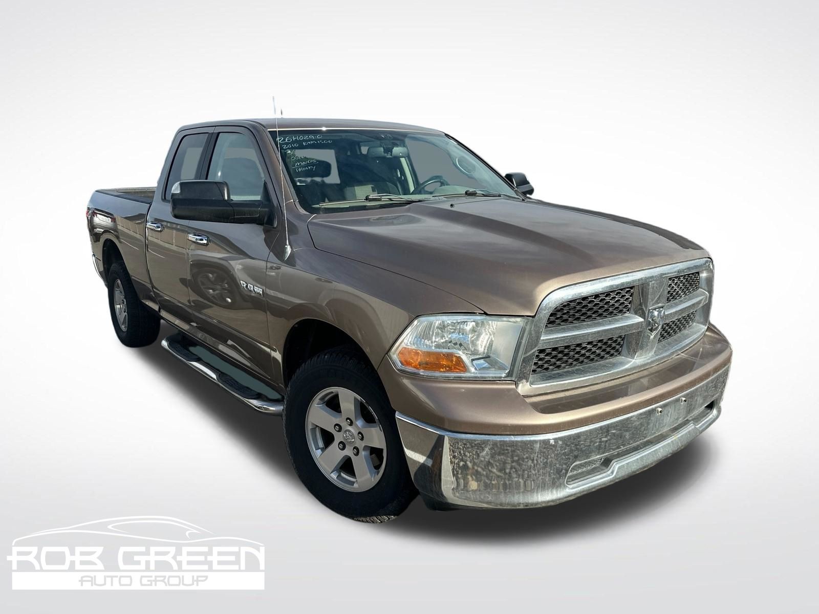 Brown (Austin Tan Pearlcoat/Light Graystone Pearlcoat) 2010 Dodge RAM 1500 Pickup Truck Four-Wheel Drive 5-Speed Automatic