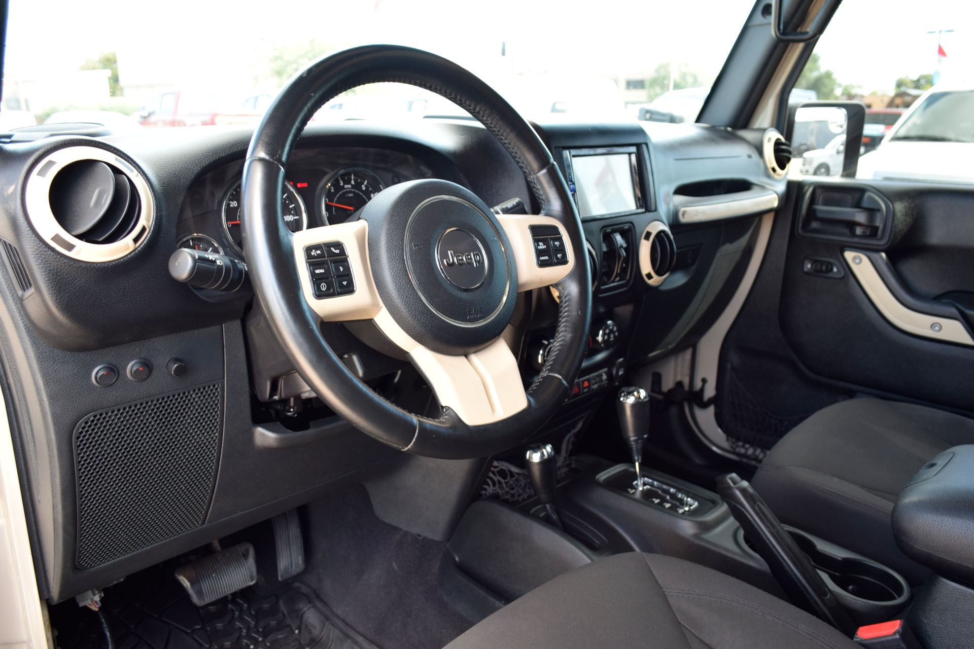 2016 Jeep Wrangler Unlimited Sport Beige at DeMontrond Automotive Group