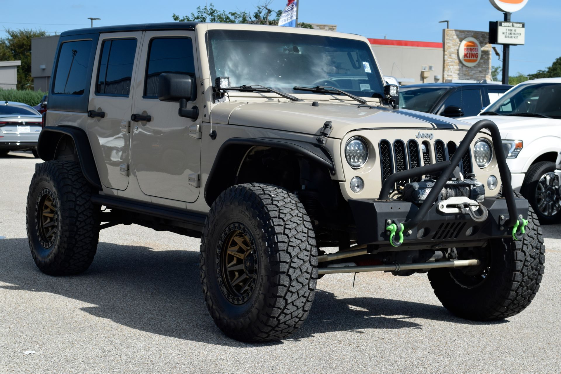 2016 Jeep Wrangler Unlimited Sport Beige at DeMontrond Automotive Group