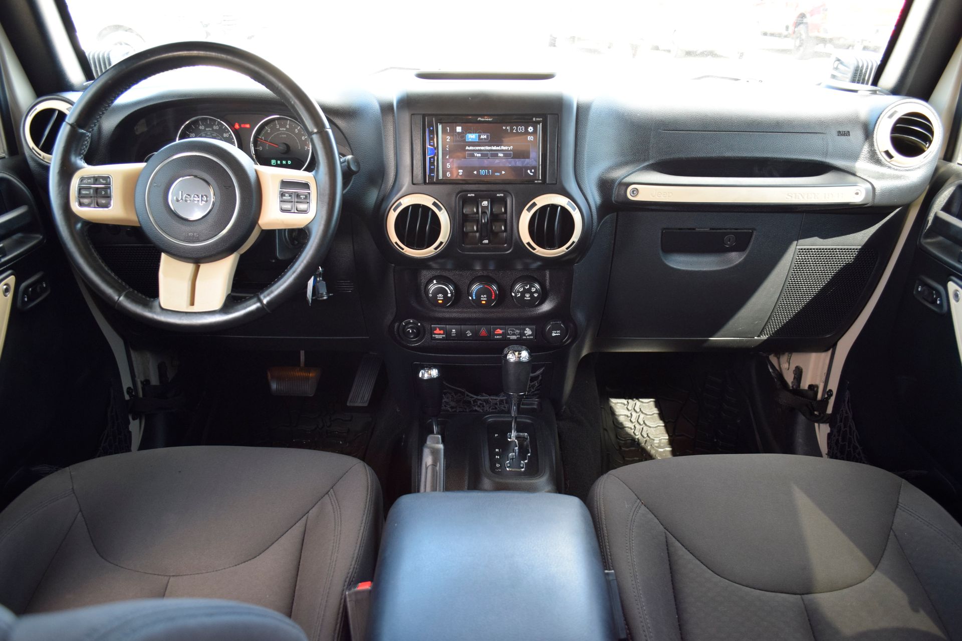 2016 Jeep Wrangler Unlimited Sport Beige at DeMontrond Automotive Group