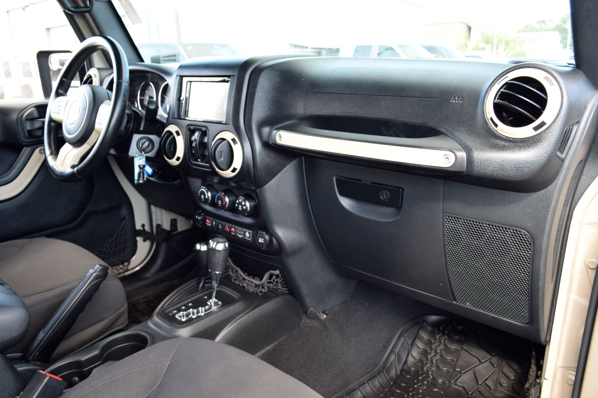 2016 Jeep Wrangler Unlimited Sport Beige at DeMontrond Automotive Group