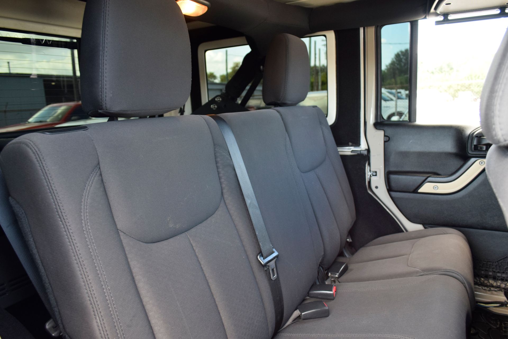 2016 Jeep Wrangler Unlimited Sport Beige at DeMontrond Automotive Group