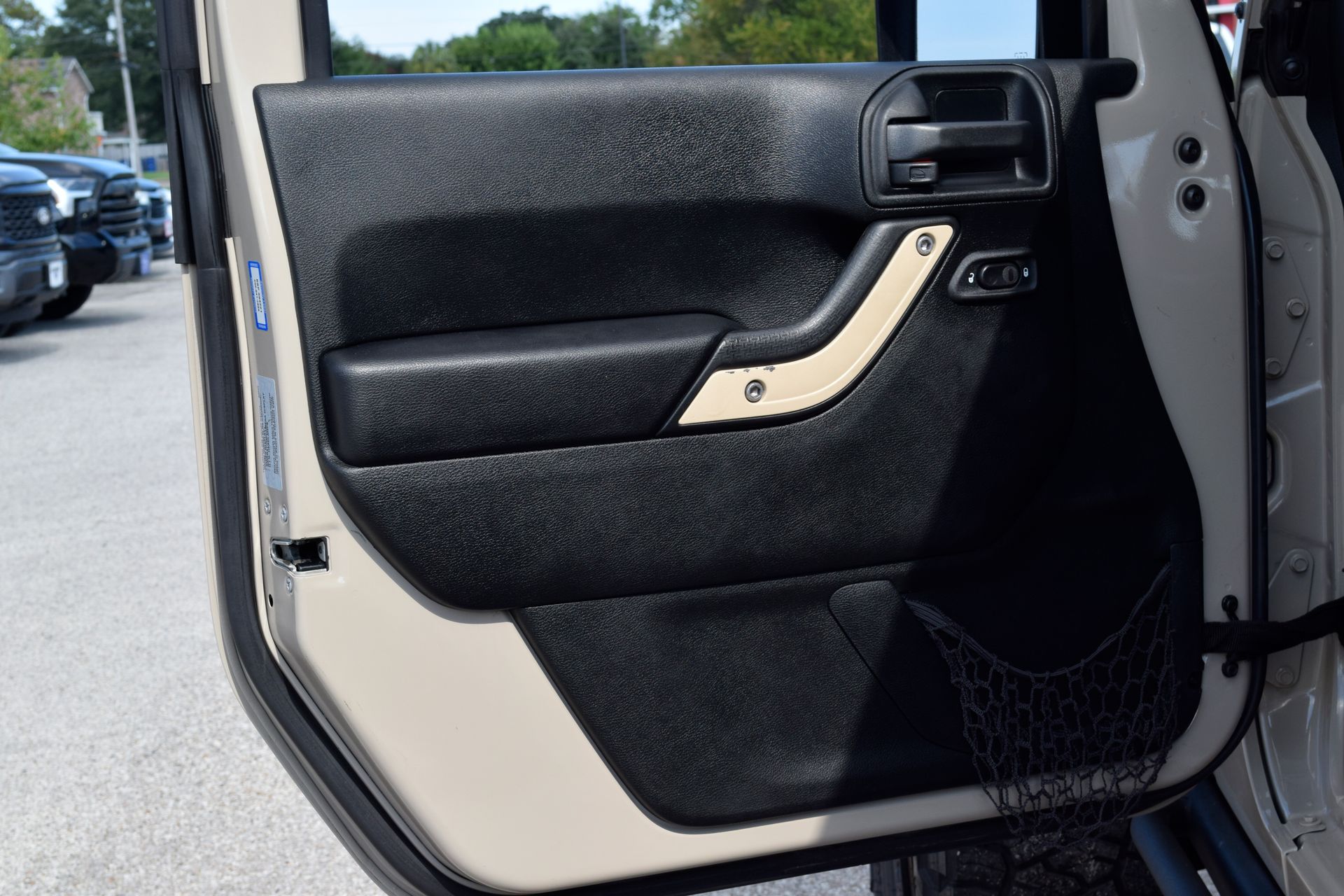 2016 Jeep Wrangler Unlimited Sport Beige at DeMontrond Automotive Group