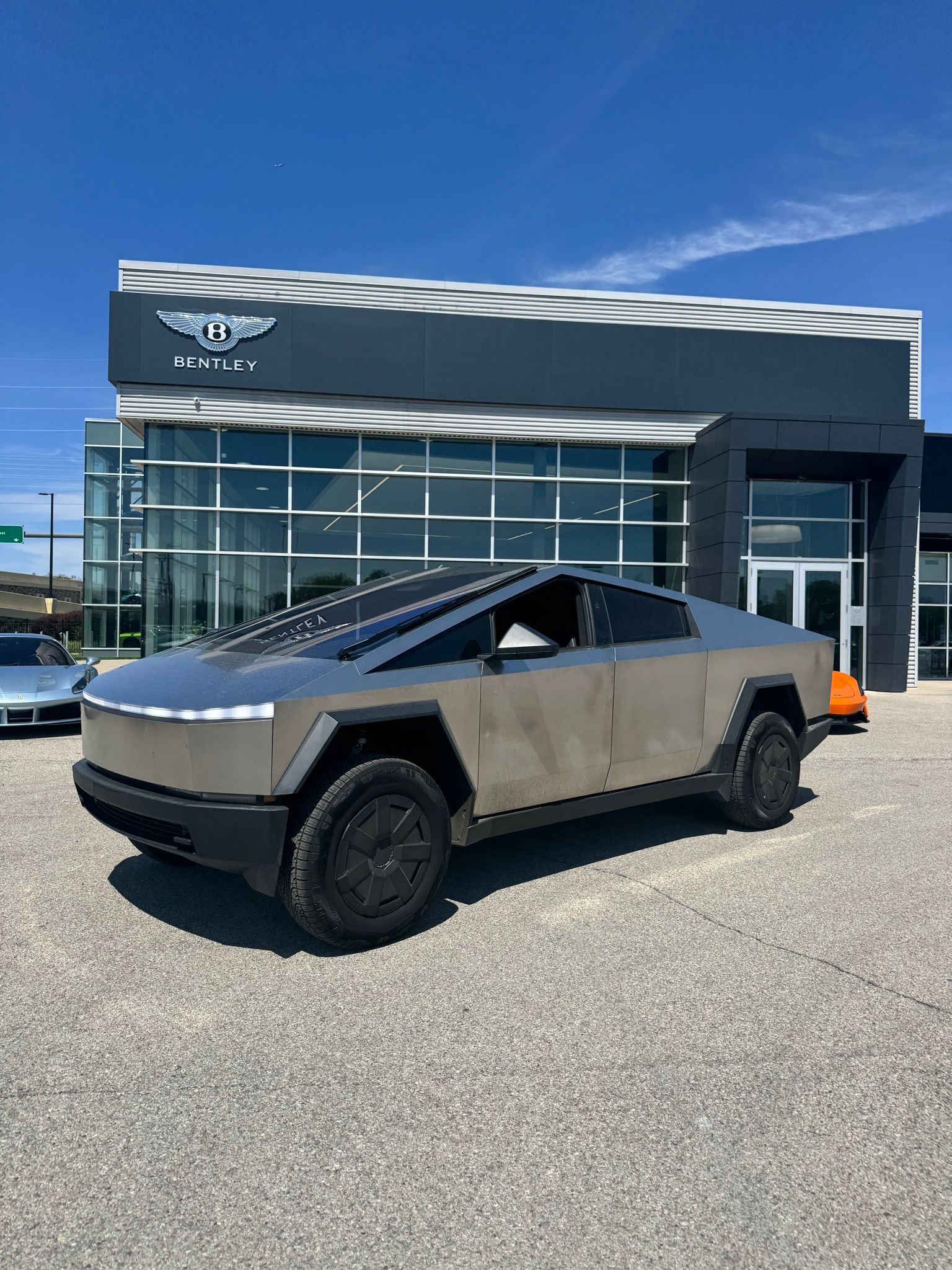 Gray (Stainless Steel) 2024 Tesla Cybertruck Crew Cab AWD Pickup Truck All-Wheel Drive 1-Speed Automatic