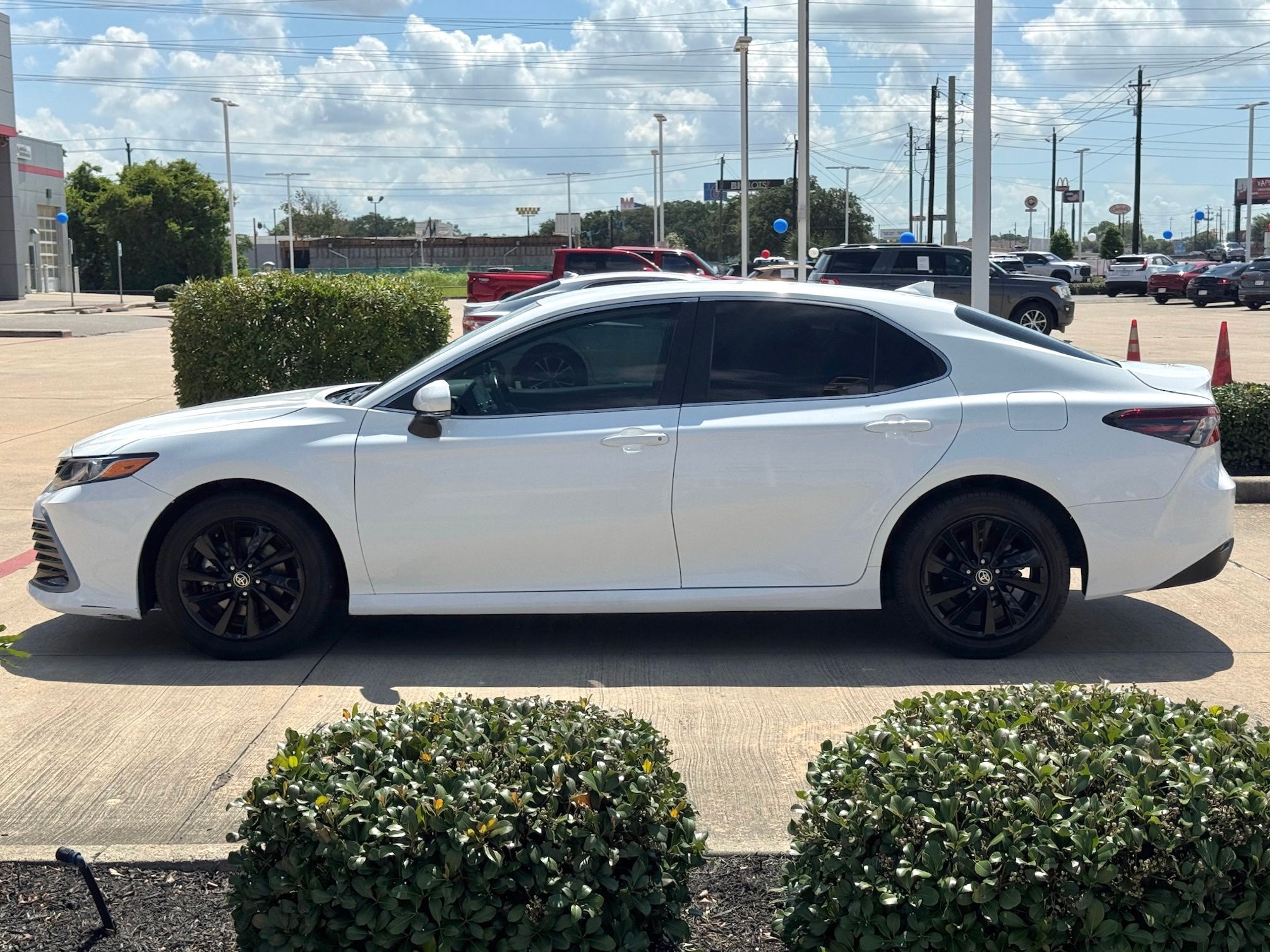 2024 Toyota Camry LE White at Classic Elite Chevrolet Sugar Land