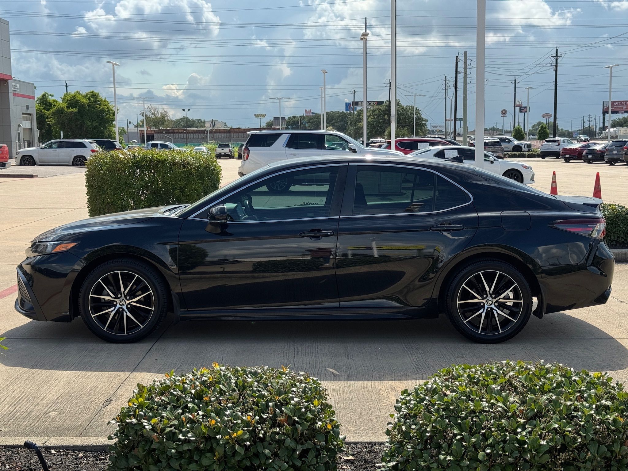 2024 Toyota Camry SE Black at Classic Elite Chevrolet Sugar Land
