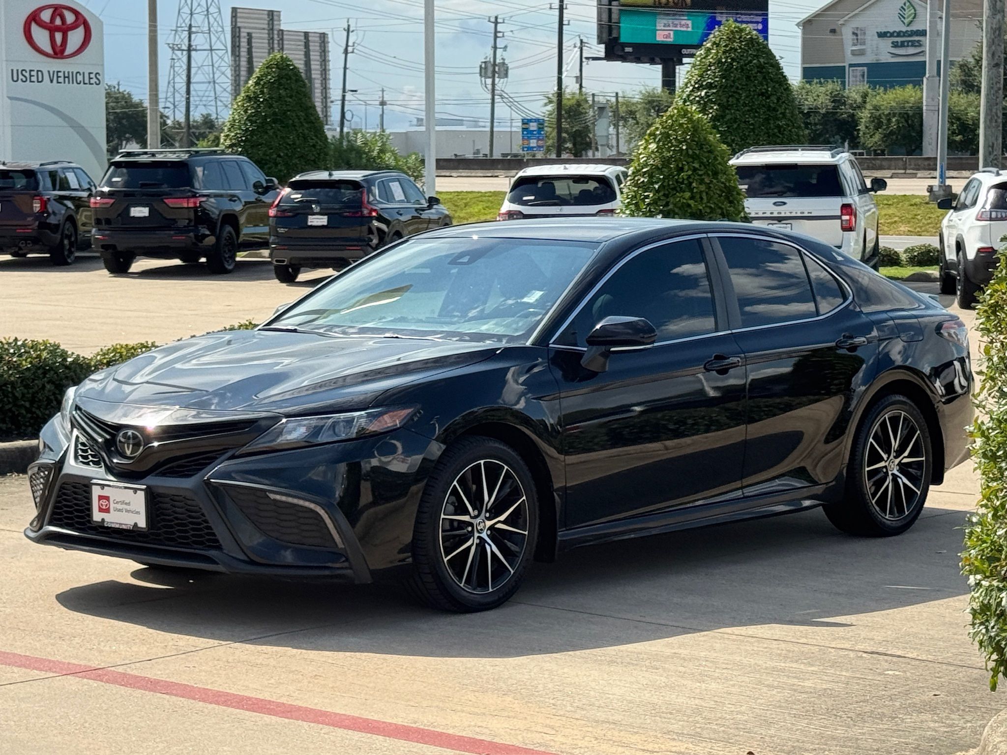 2024 Toyota Camry SE Black at Classic Elite Chevrolet Sugar Land