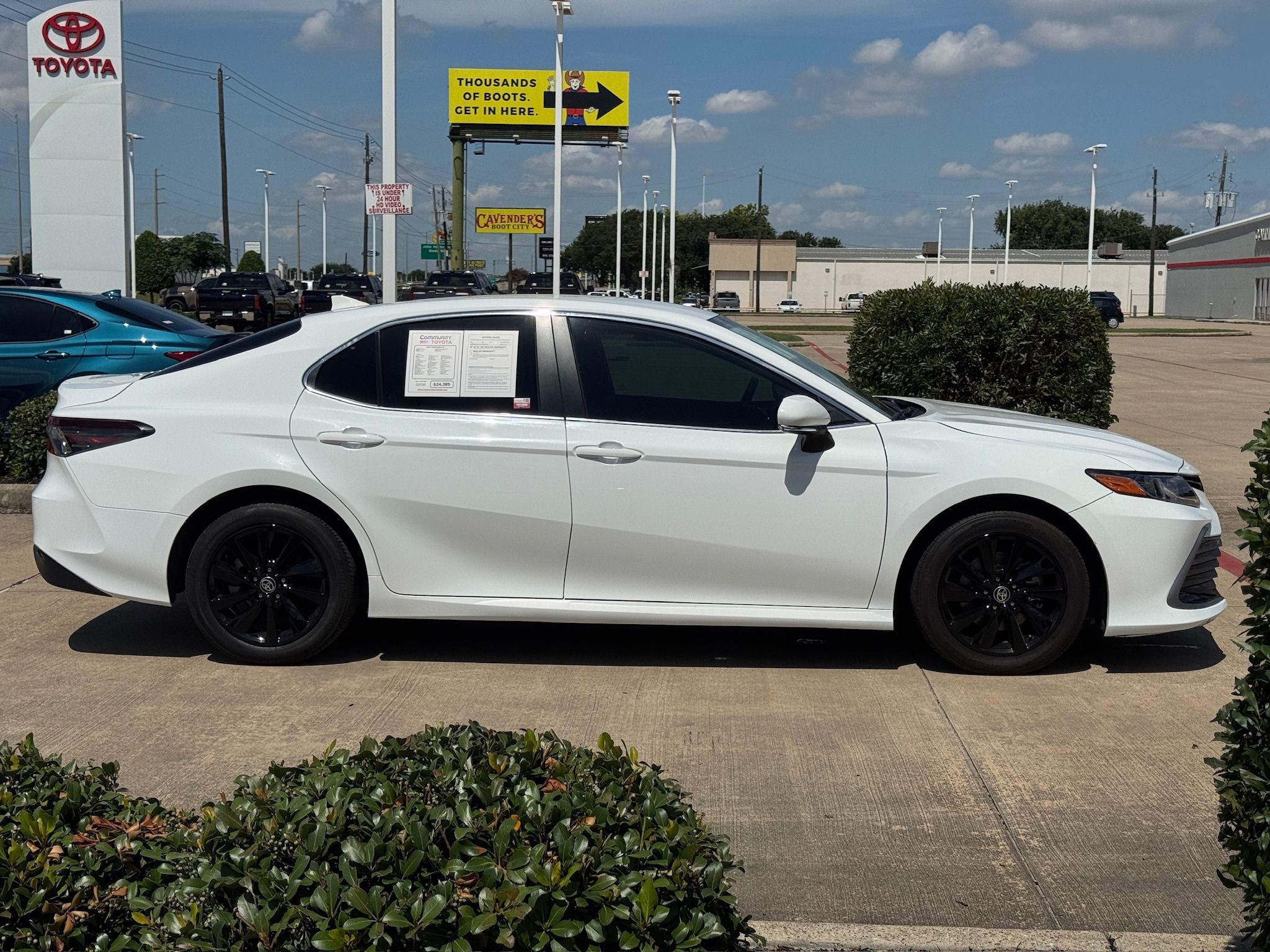 2024 Toyota Camry LE White at Classic Elite Chevrolet Sugar Land