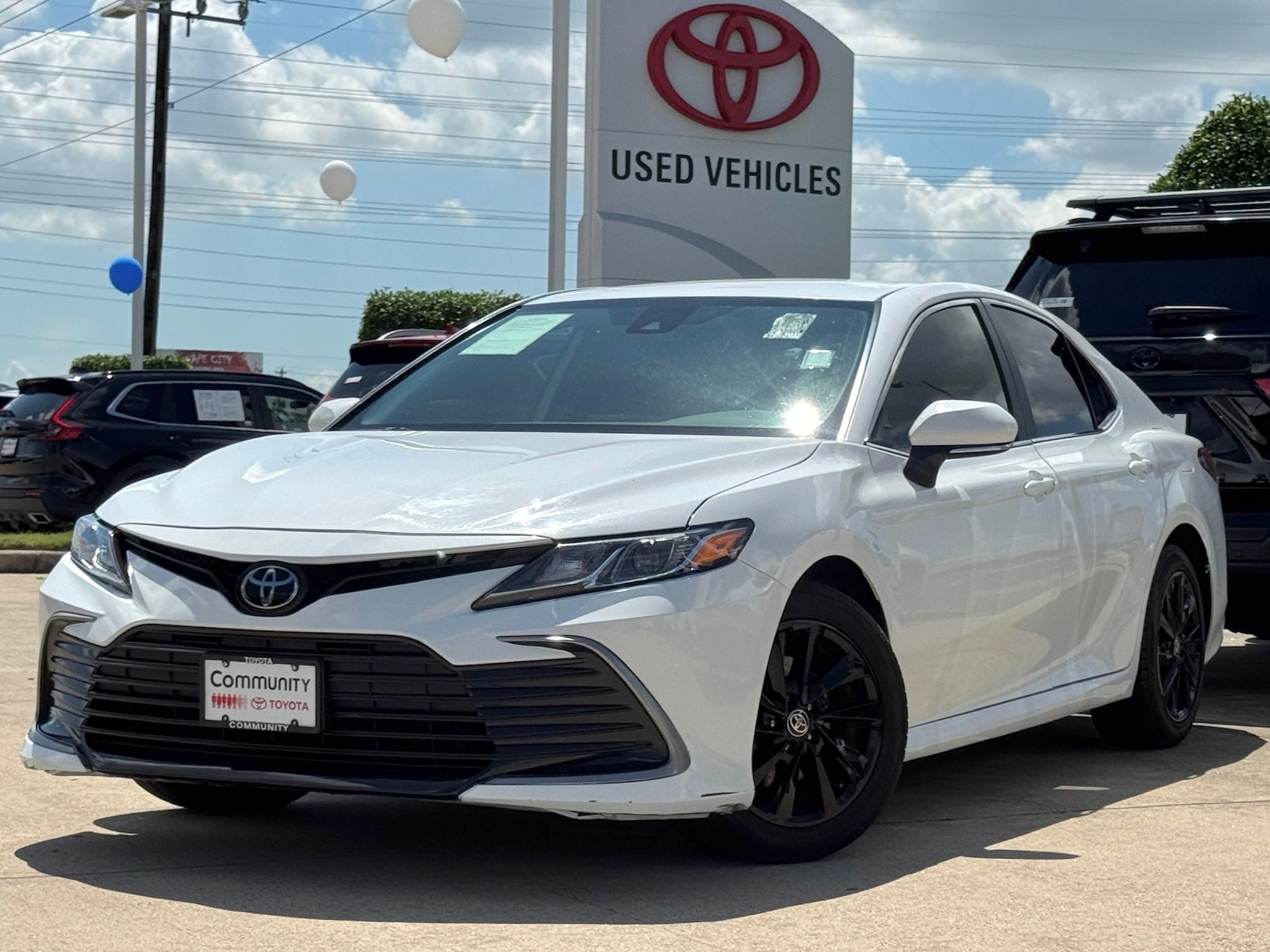 2024 Toyota Camry LE White at Classic Elite Chevrolet Sugar Land