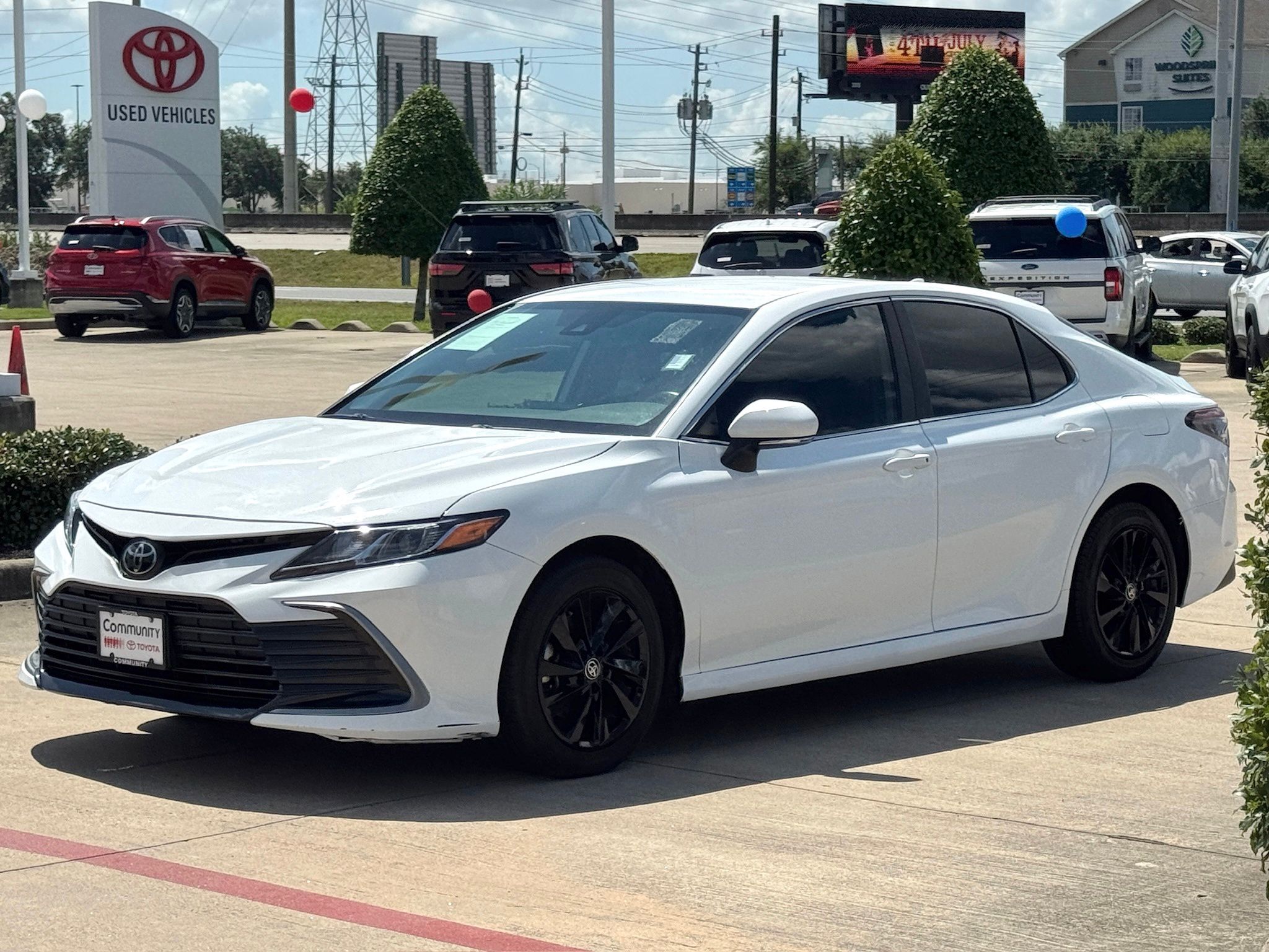 2024 Toyota Camry LE White at Classic Elite Chevrolet Sugar Land
