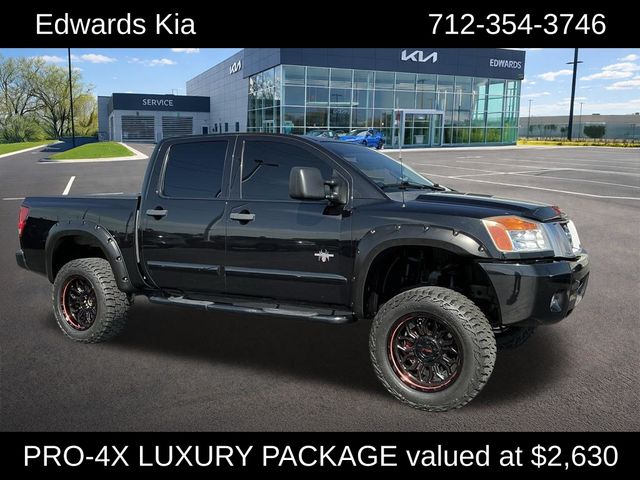 Galaxy Black Metallic 2014 Nissan Titan Pickup Truck Four-Wheel Drive 5-Speed Automatic