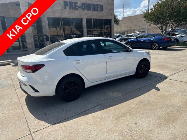 Clear White 2023 Kia Rio Sedan Front-Wheel Drive Continuously Variable Transmission