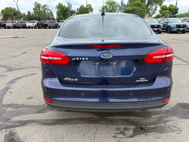 2016 Blue Ford Focus SE FWD Sedan